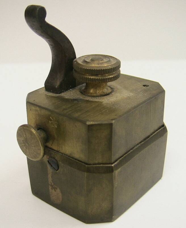 Small unmarked brass temple scarificator.  Note the presence of only 6 blades.  Designed to bleed very small areas of the body.